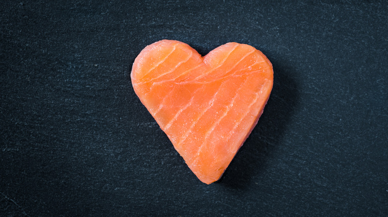 A piece of salmon cut in the shape of a heart