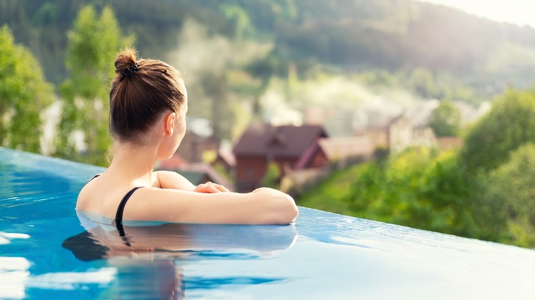 a woman is in a pool