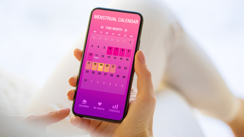 someone tracks their period on their phone