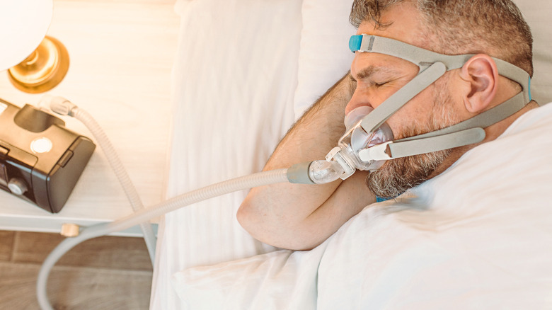 man wearing cpap machine