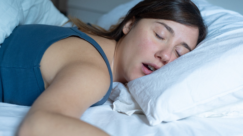 woman snoring in bed