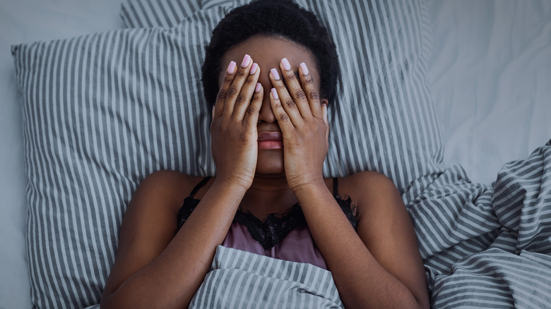 tired woman in bed