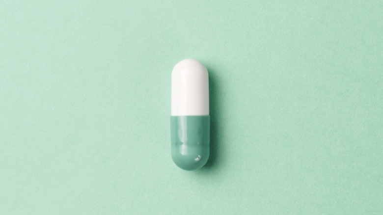 pill on green background