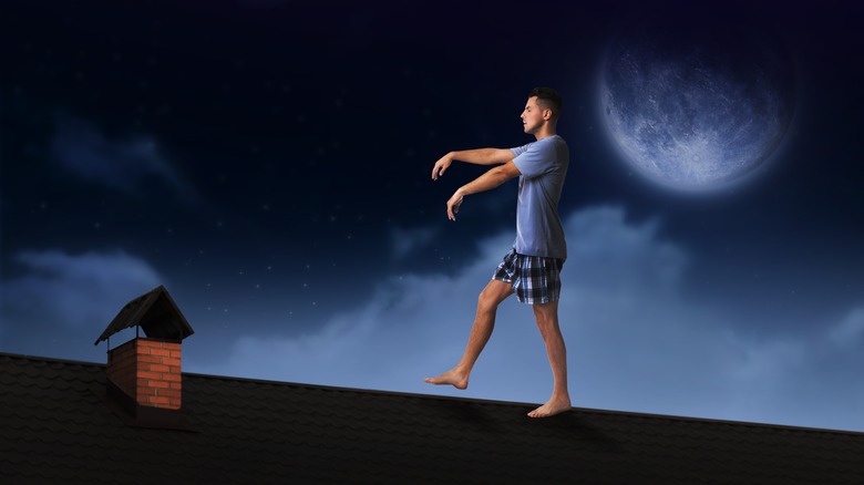 image of man sleepwalking outside