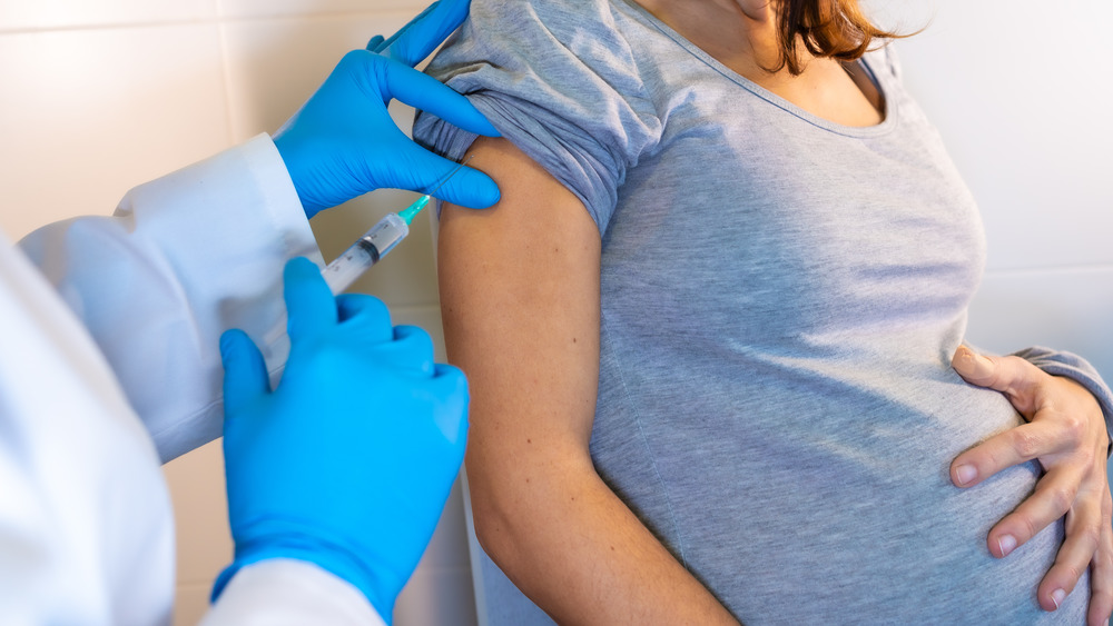 Pregnant woman getting a vaccine