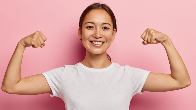 Woman flexing muscles