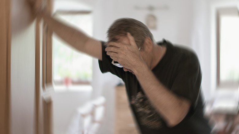 man holding his head