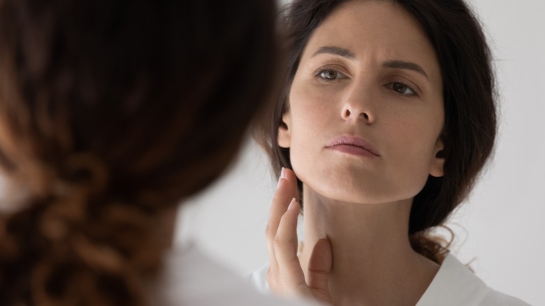 woman looking in mirror close up