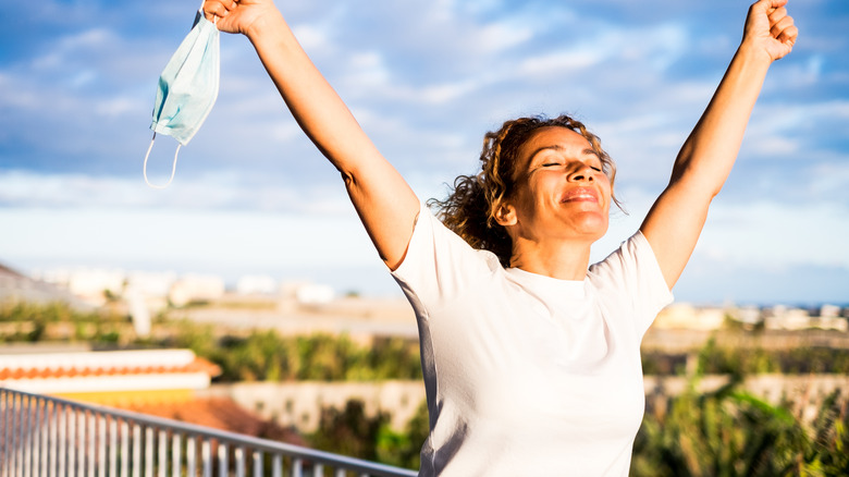 woman liberated from wearing her mask outdoors