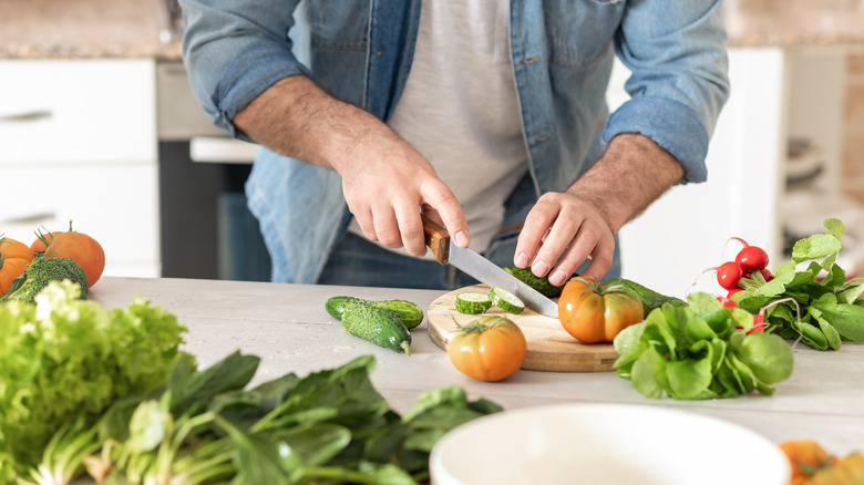 Man making green salad