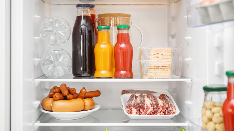Shelf of meats in fridge