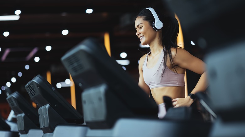 Fit woman running on the treadmill