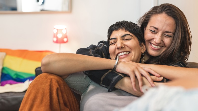 Two women happily cuddling