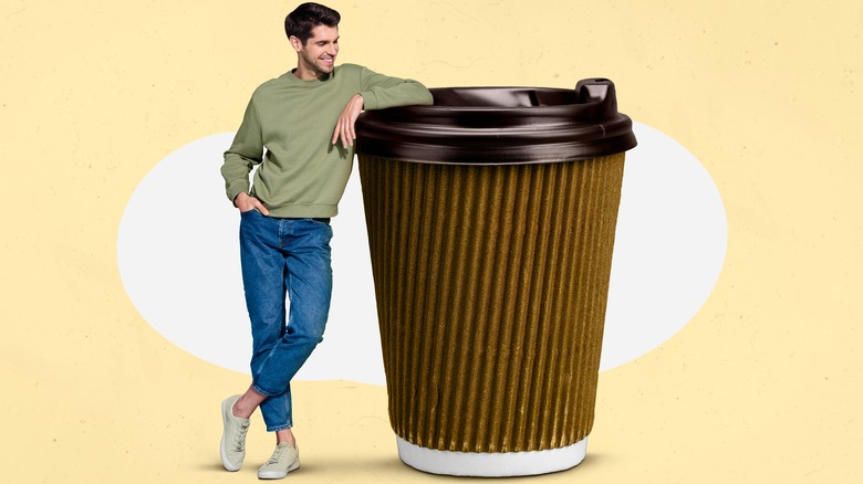 man with large coffee cup