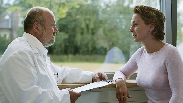 woman speaking with doctor