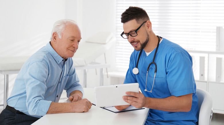 Elderly man with doctor