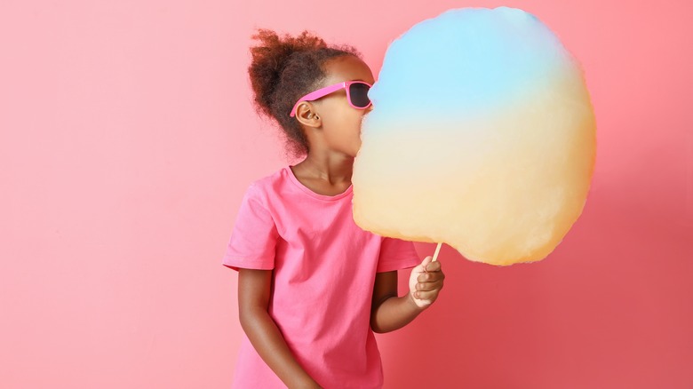 Little girl with cotton candy