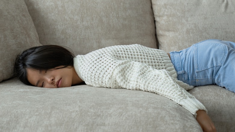 woman sleeping sofa