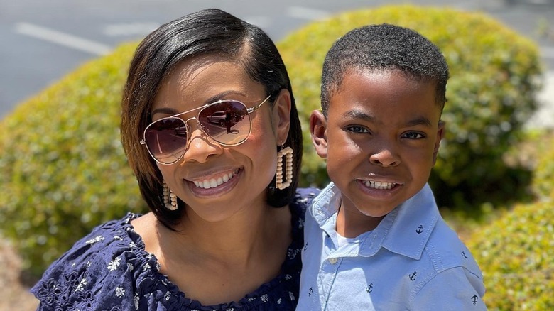 Dr. Kenosha Gleaton posing with her oldest son