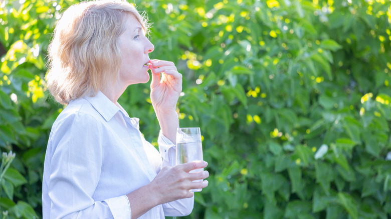 woman taking supplements