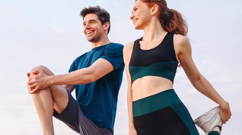 Couple stretching before exercise