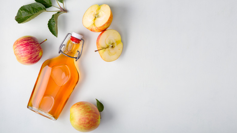 Apple cider vinegar bottle on table