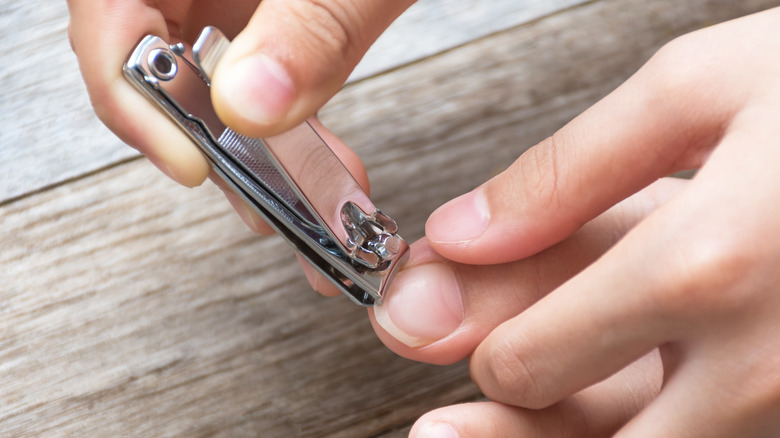 Clipping toenails with nailcutter