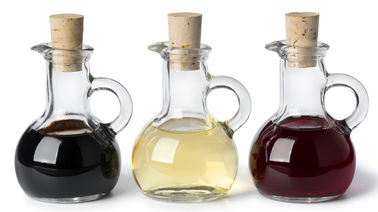 Three bottles of vinegar