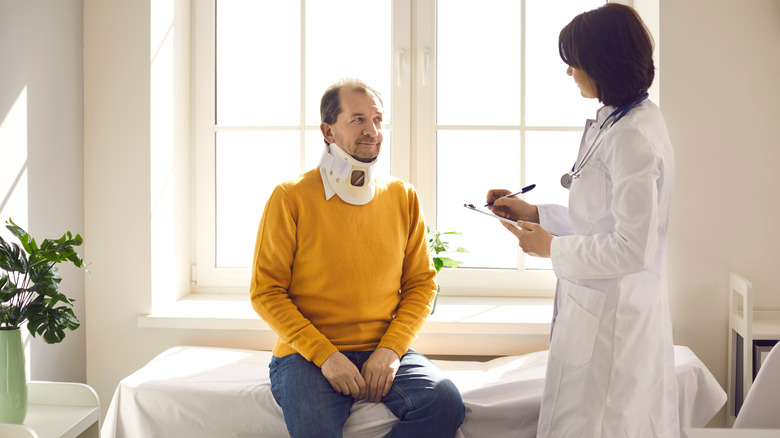 Man speaking to doctor