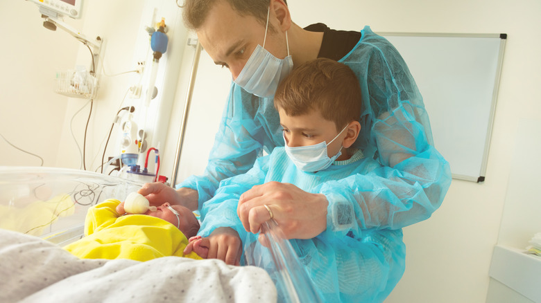 man with son at the hospital