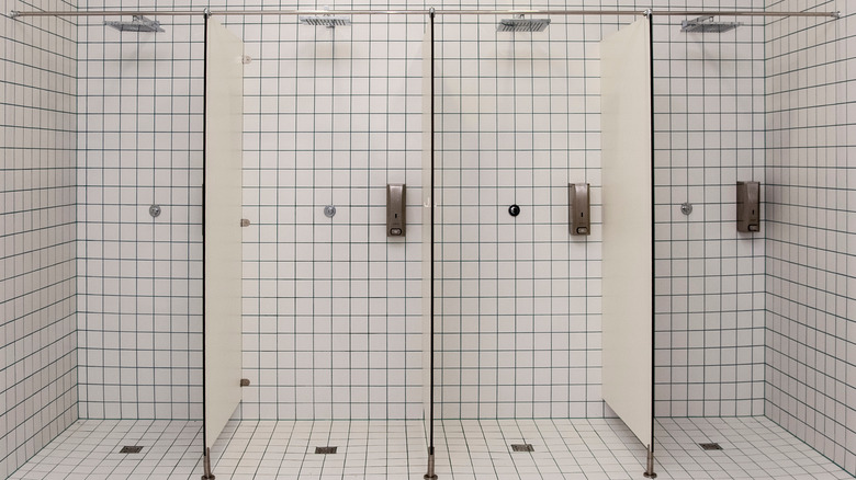 A row of empty public showers 