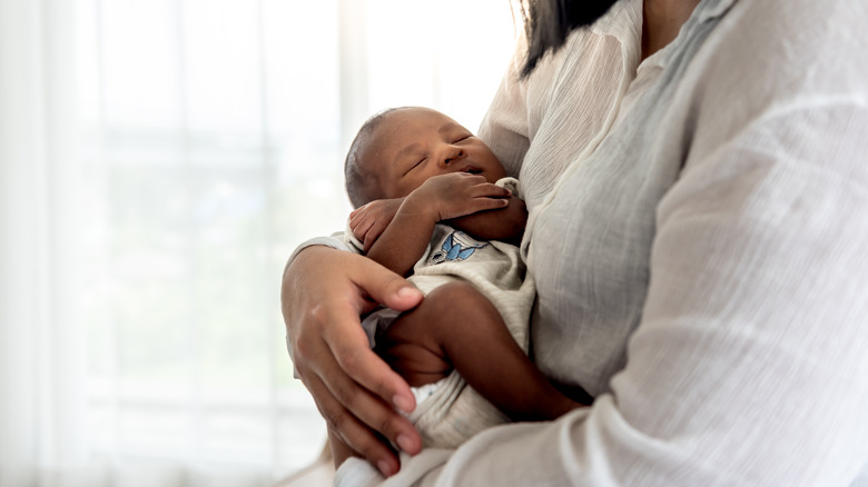 mom holding new baby