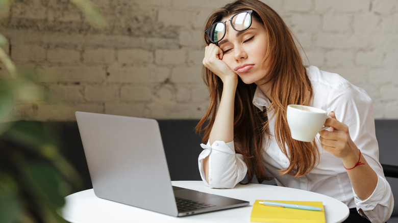 sleep-deprived woman tired during breakfast