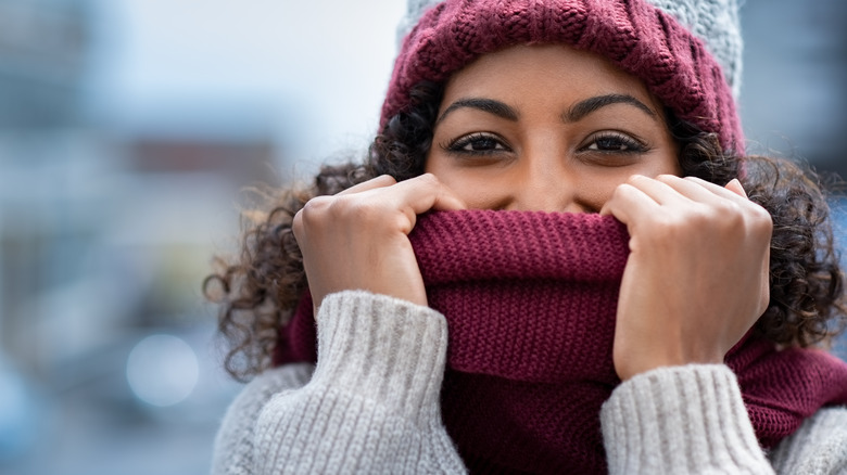 woman with scarf over nose