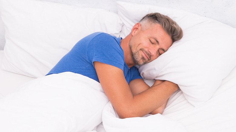 middle-aged man sleeping blissfully