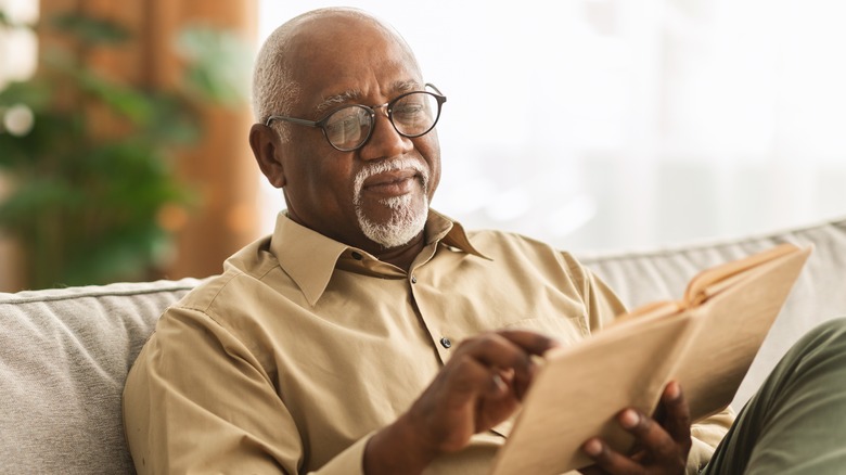 older man reading a book