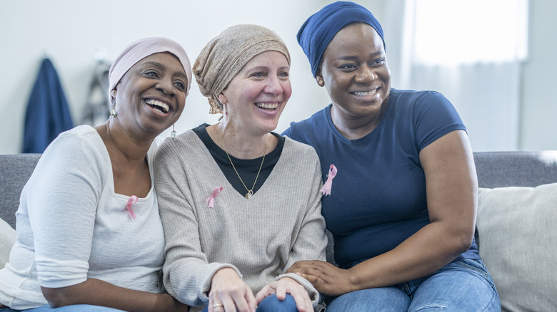 three breast cancer survivors sitting together 