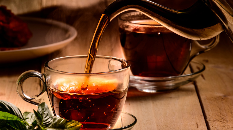 Pouring glass of tea