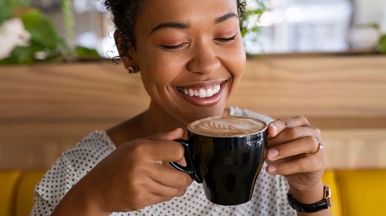 African-American woman enjoying a cup of coffee