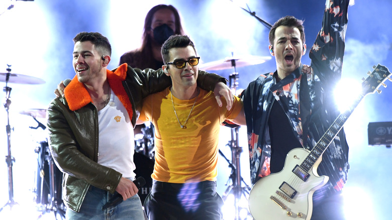 The Jonas Brothers performing onstage for the Billboard Music Awards