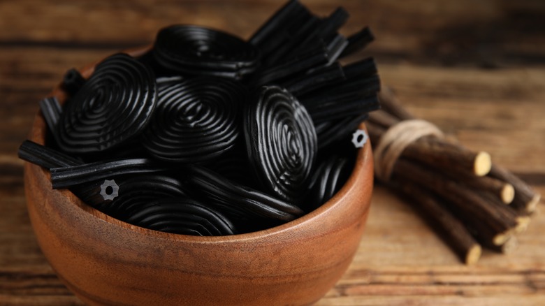 Black-colored candy and dried licorice root
