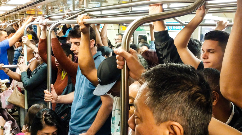 Passengers aboard an overcrowded bus