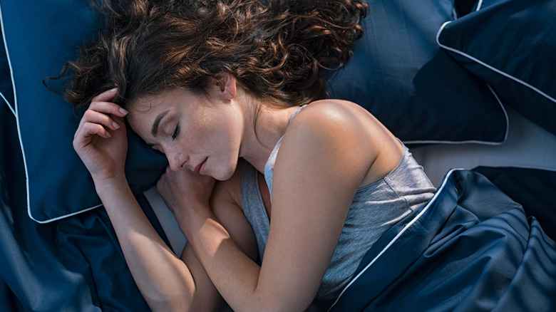 Woman sleeping peacfully in bed