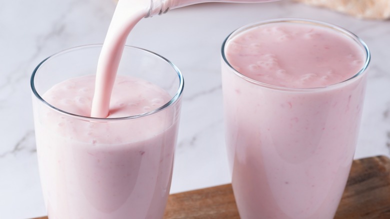 pouring strawberry kefir