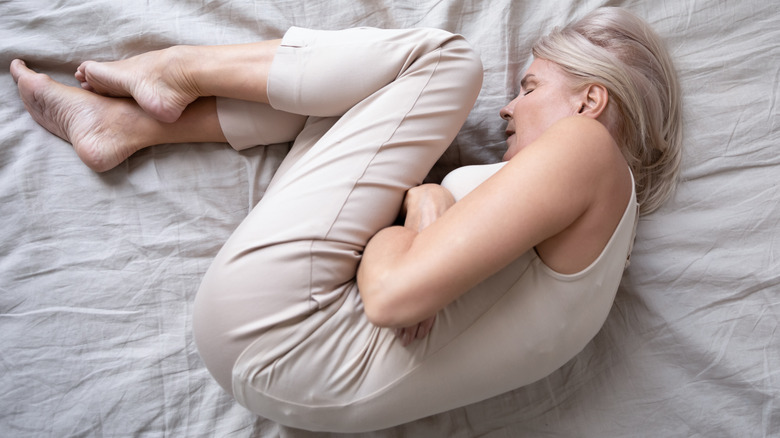 woman sleeping in fetal position