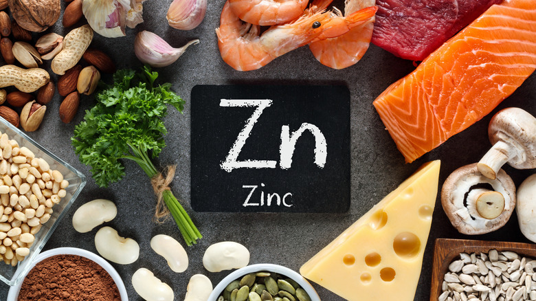 Foods rich in zinc surround the chemical symbol Zn