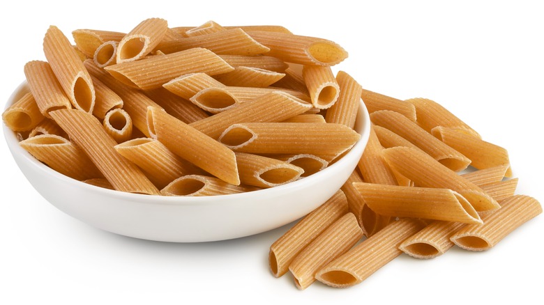 Bowl of uncooked whole-grain pasta