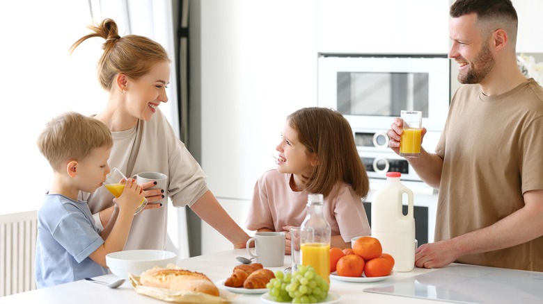 happy family eating healthy breakfast