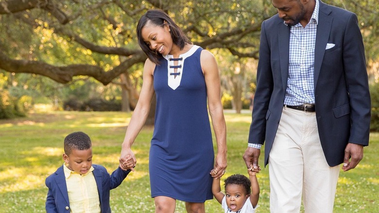 Dr. Kenosha Gleaton walking with partner and children