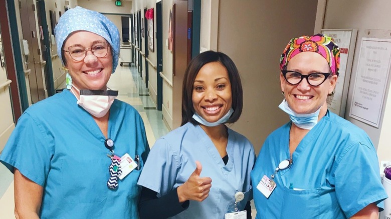 Dr. Kenosha Gleaton smiling with colleagues 